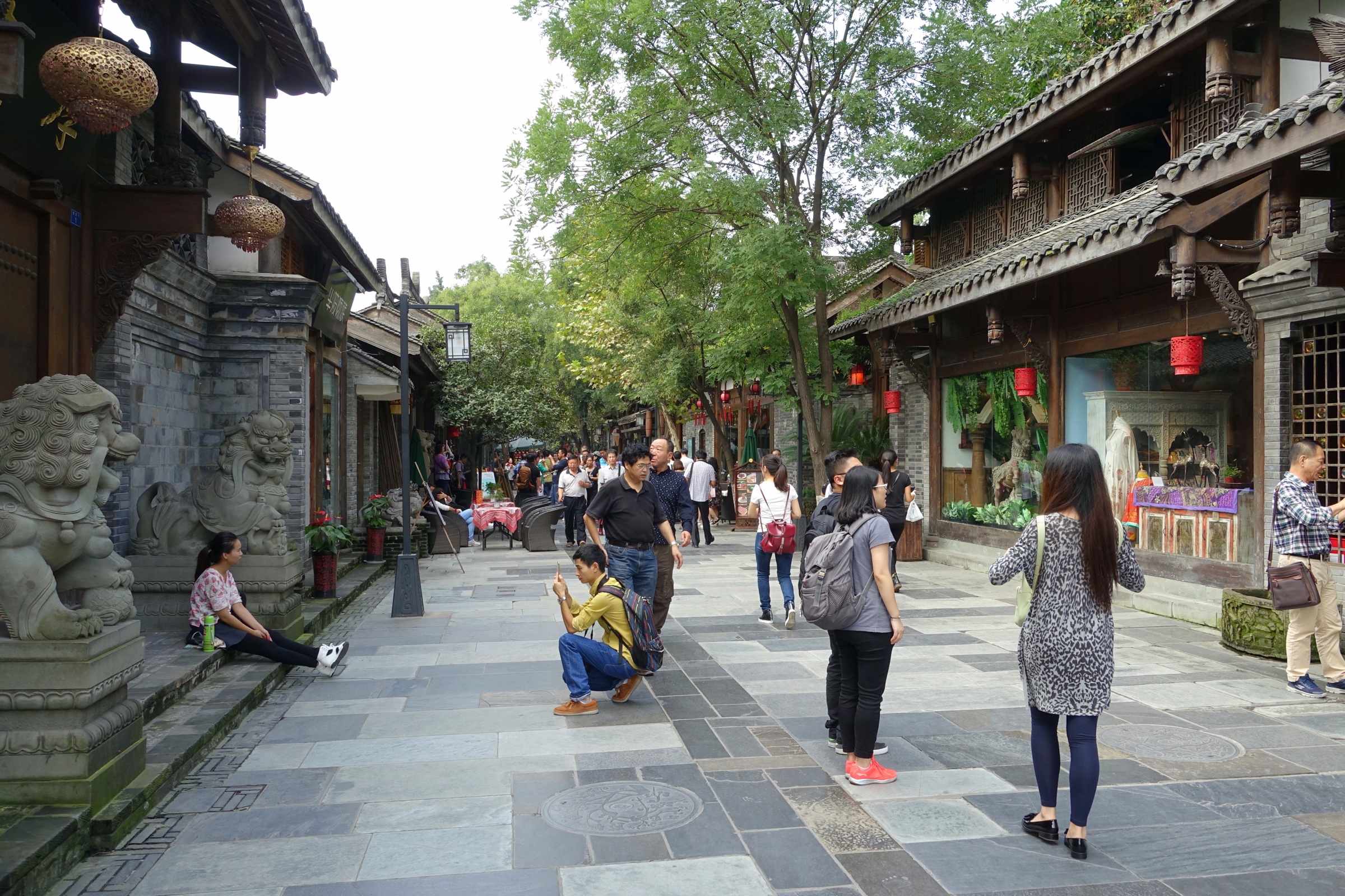 Visitors walking past traditional-style storefronts in Chengdu's Kuanzhai Alleys