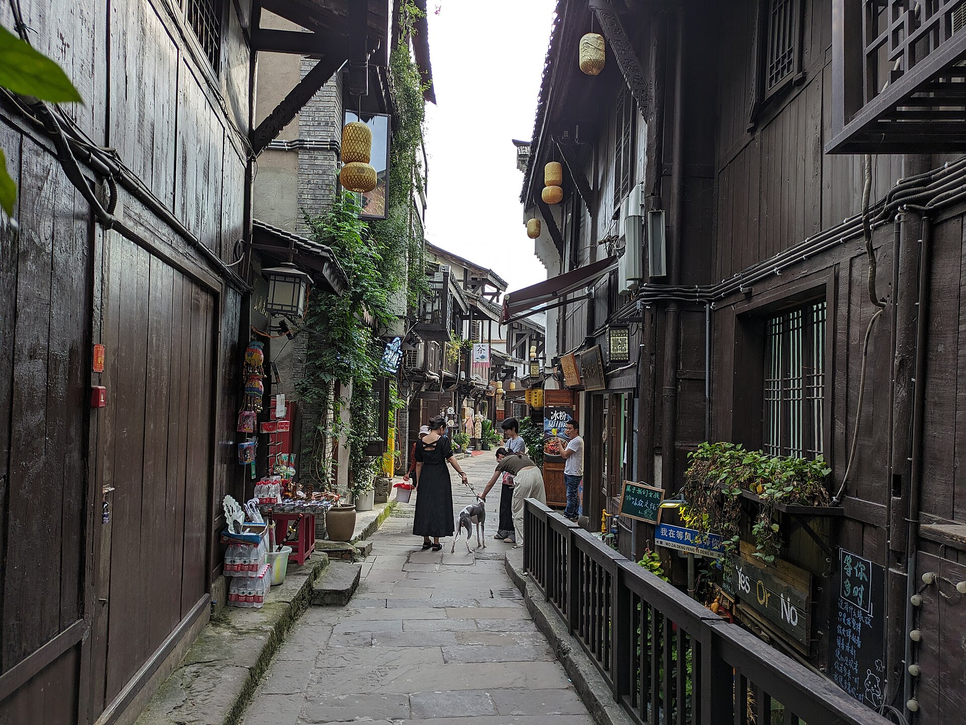 A stone-paved street lined with traditional buildings in Ciqikou, Chongqing