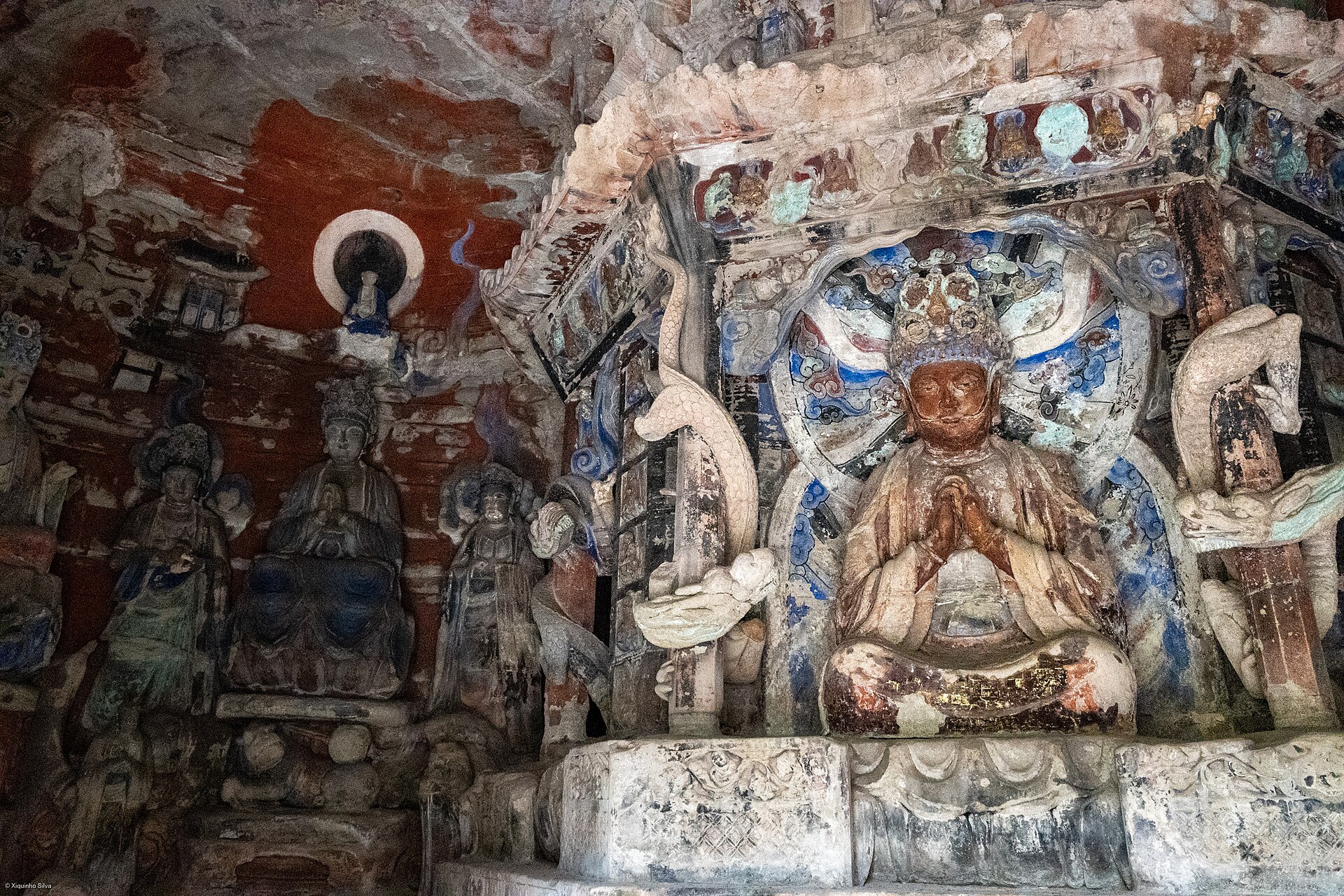 Detailed Buddhist figures carved into the rock face at Baodingshan in Dazu