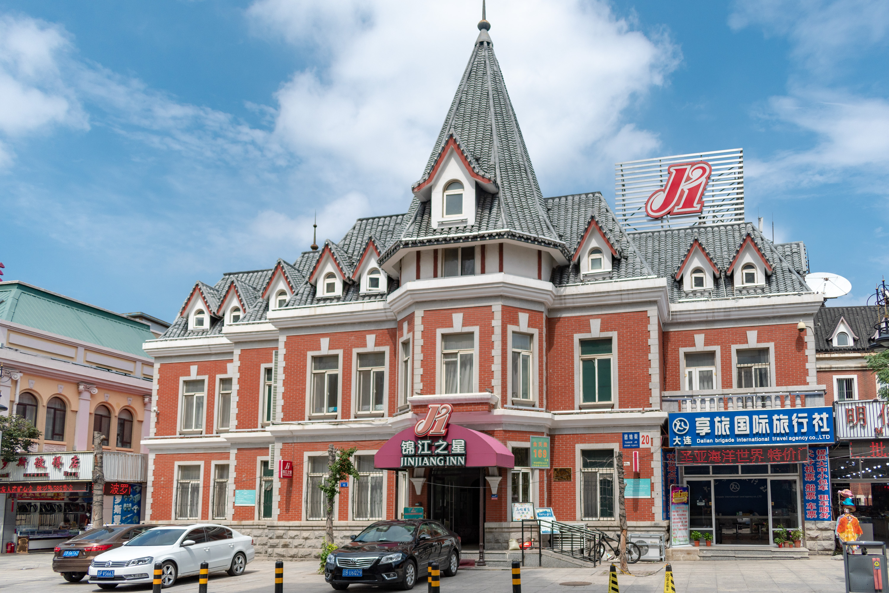 Historic-style facades and pedestrians along Russian Folk Street in Dalian