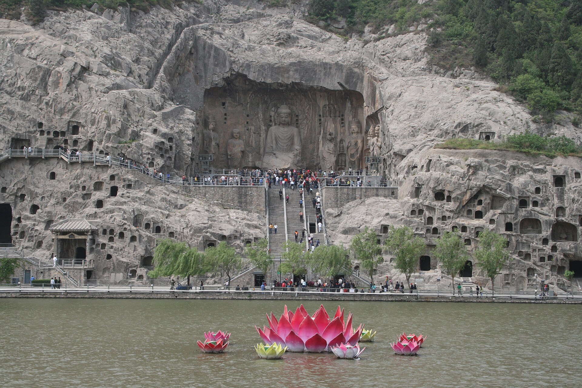 Buddhist cave carvings and limestone cliffs at the Longmen Grottoes in Luoyang