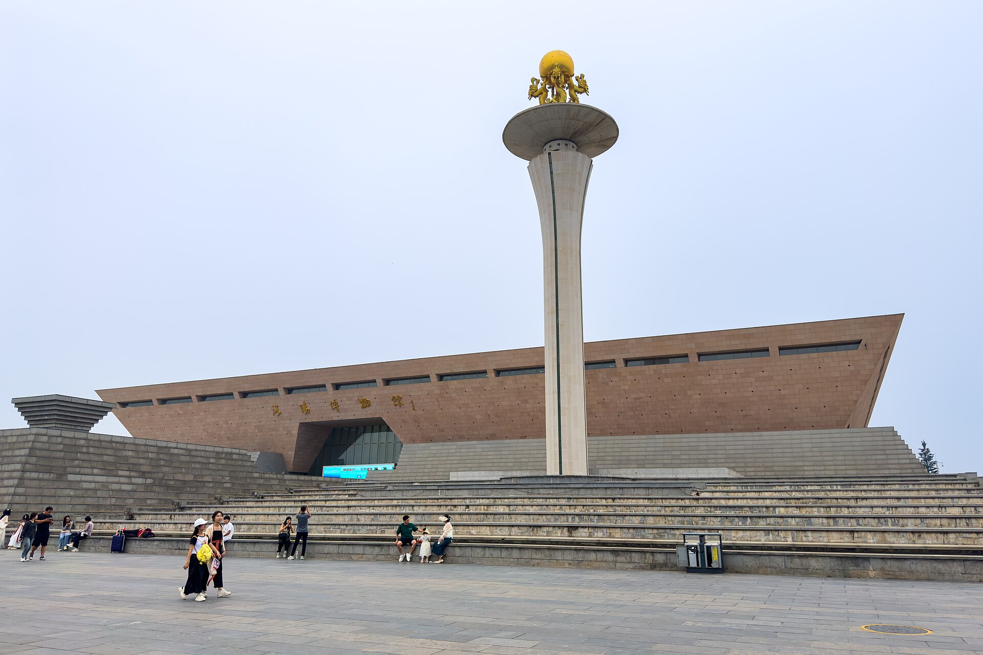 Exterior of the modern Luoyang Museum building under a blue sky