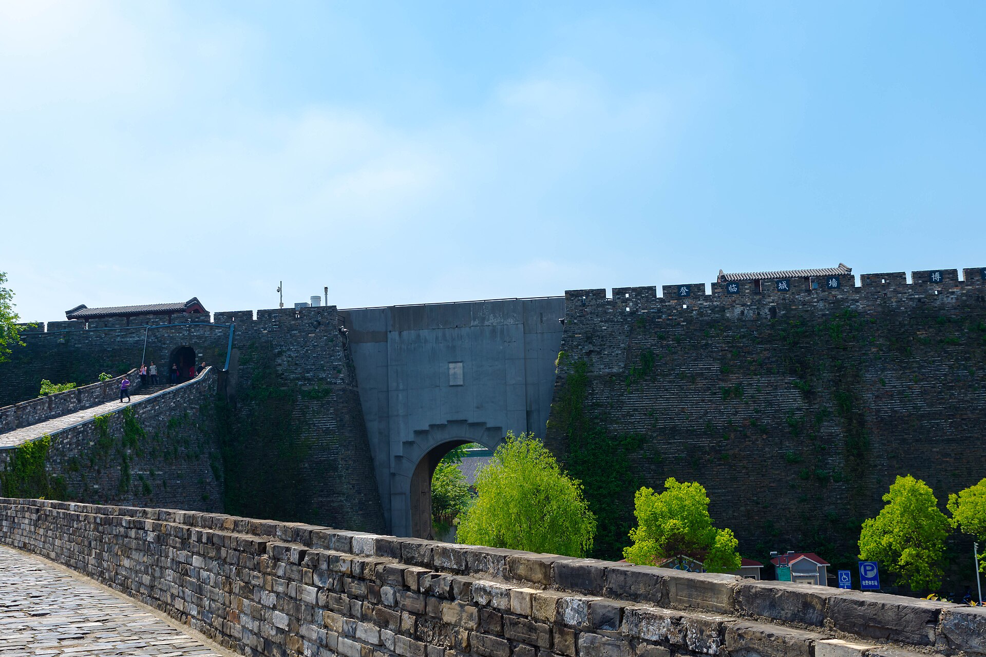 Brick ramparts and a tree-lined section of Nanjing's Ming city wall