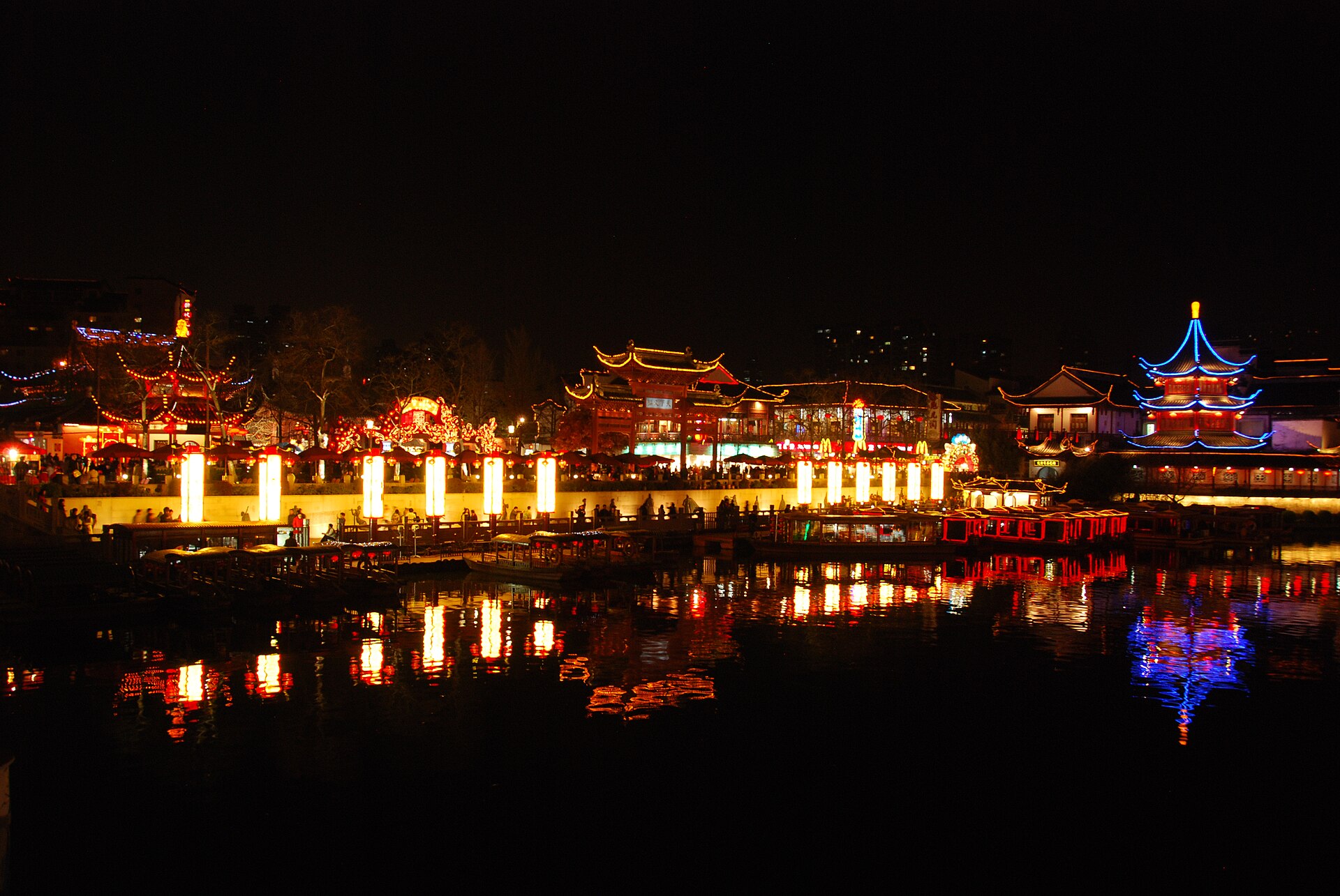 Illuminated traditional buildings reflected in the Qinhuai River by Nanjing Confucius Temple