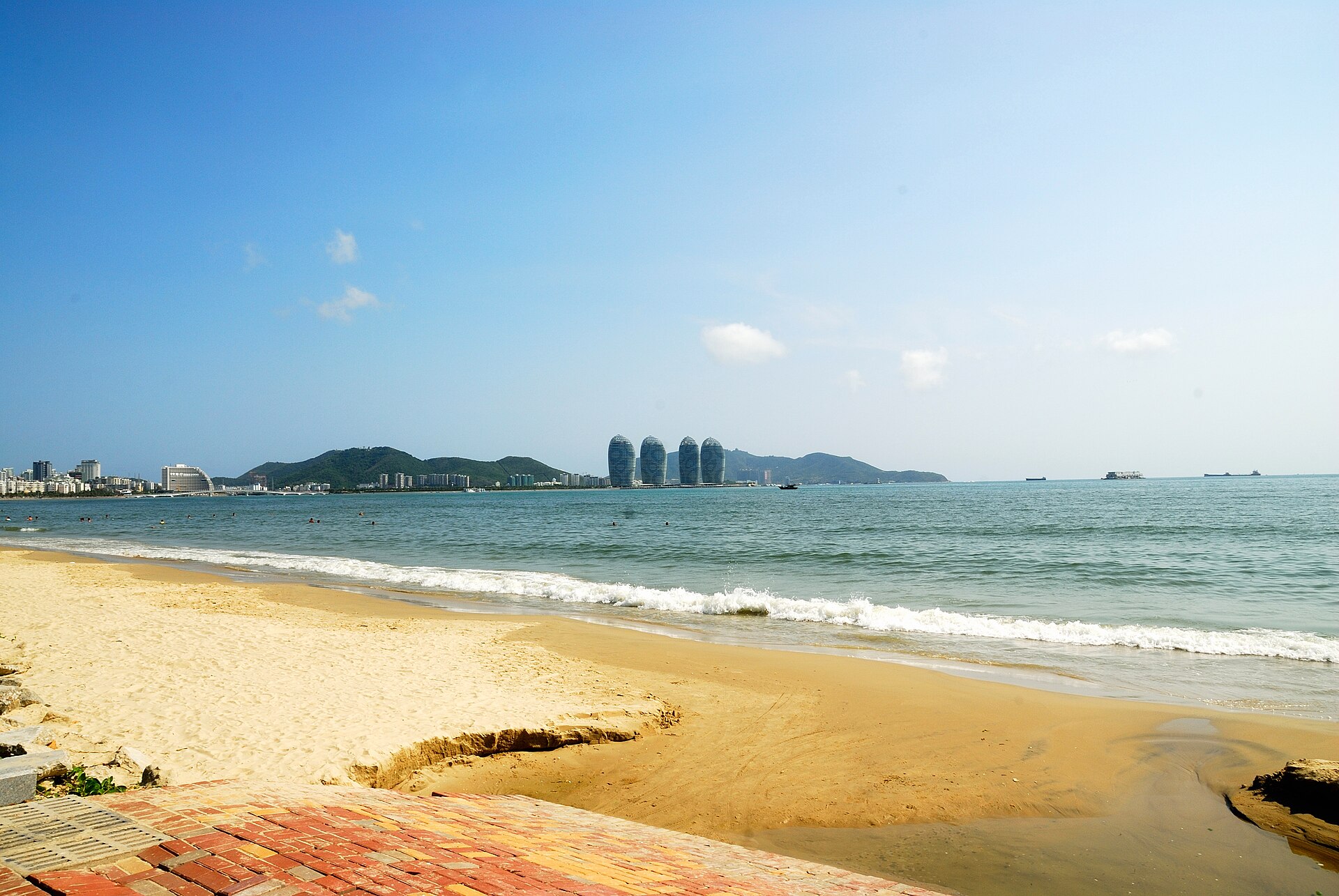 Sanya Bay beach and Phoenix Island across calm blue water
