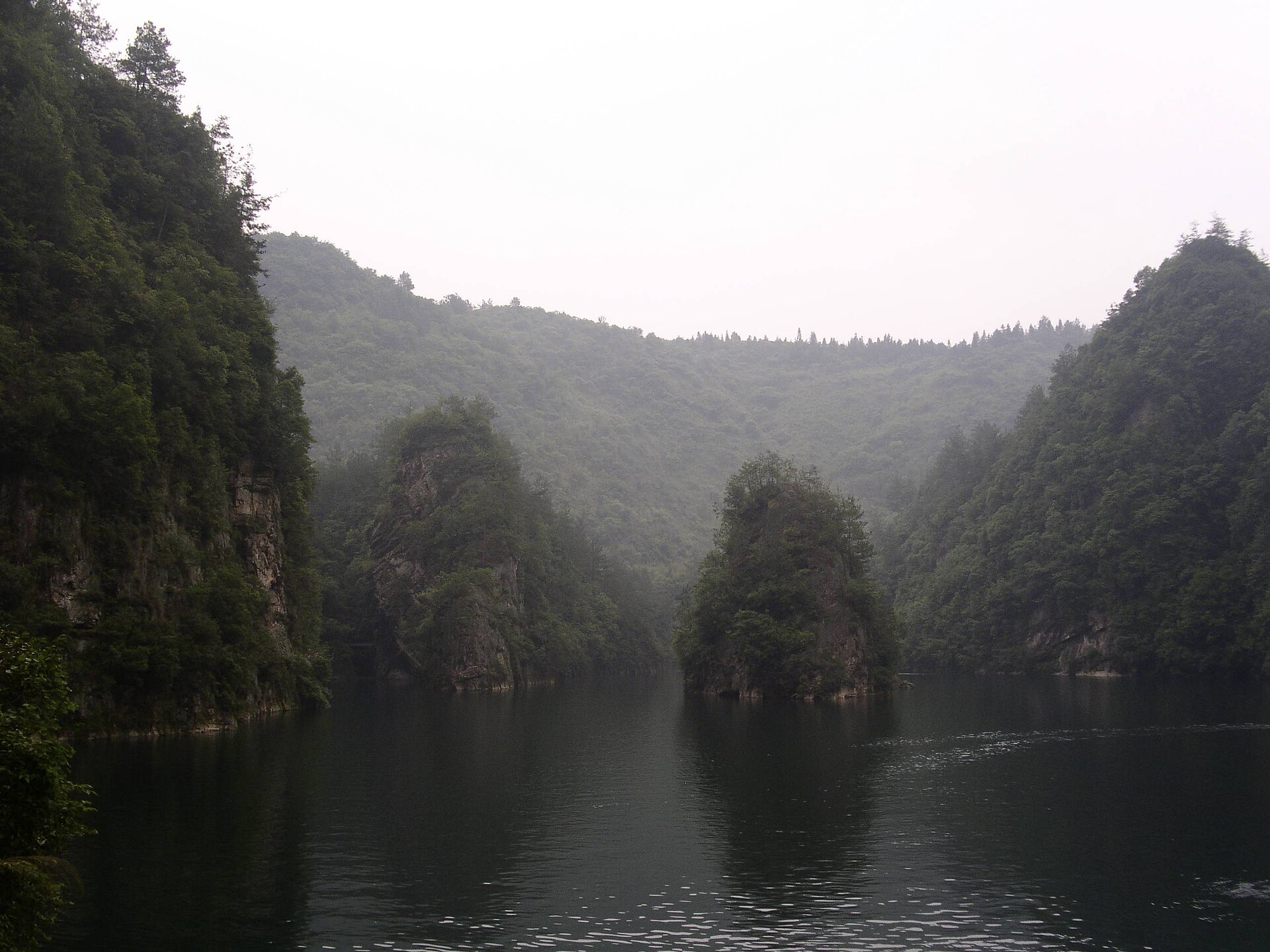Forested cliffs reflected in Baofeng Lake near Wulingyuan